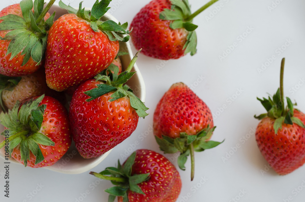 Fresh Strawberries In Bowl On White Fabric Background. Fresh Strawberries In Bowl On White Fabric Background.