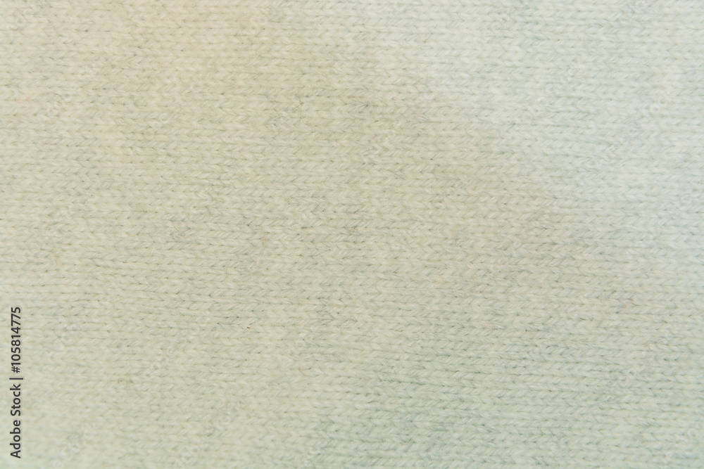 The white woolen fabric closeup with patterns The white woolen fabric closeup with patterns