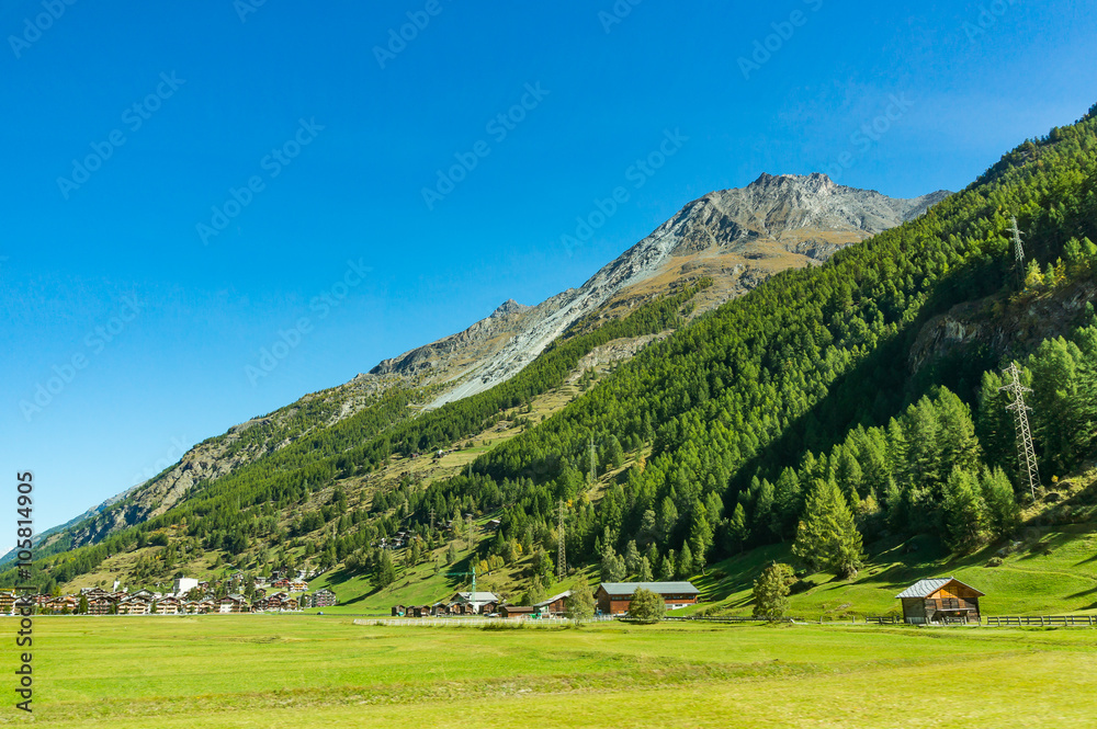 Mountain and small town during the sunshine day in Switzerland