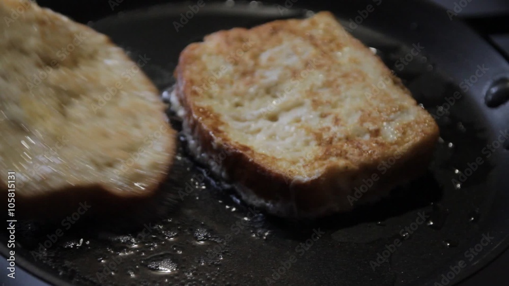 fried bread on a frying pan, a close up fried bread on a frying pan, a close up