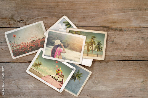 Summer photo album on wood table. instant photo of polaroid camera - vintage and retro style photo