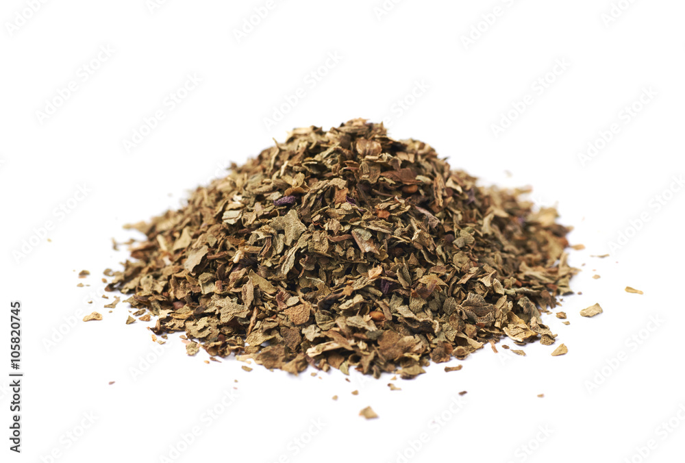 Pile of dried basil seasoning isolated Pile of dried basil seasoning isolated