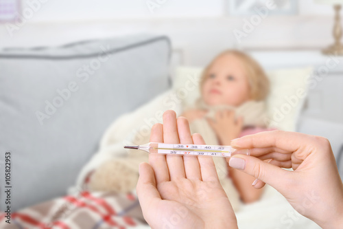 Little girl with sore throa...