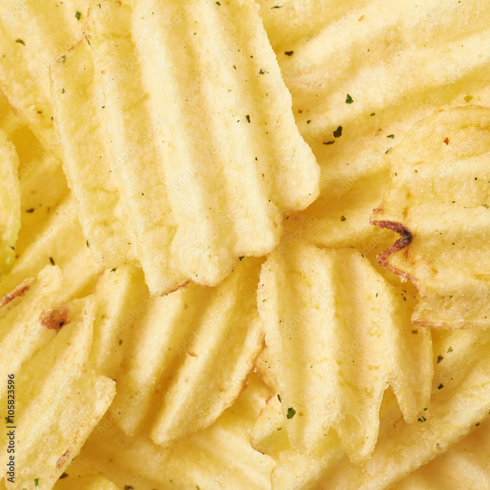 Surface covered with multiple potato chips Surface covered with multiple potato chips