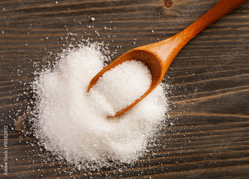 Obraz na płótnie Spoon with sugar on a wooden table w salonie