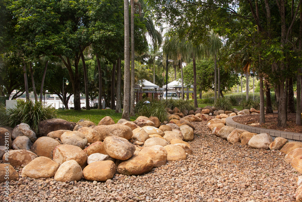 Fototapeta premium Tropical garden with rocks and stones for drainage at Southbank, Brisbane