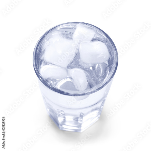 Glass of water with ice blocks isolated on white background