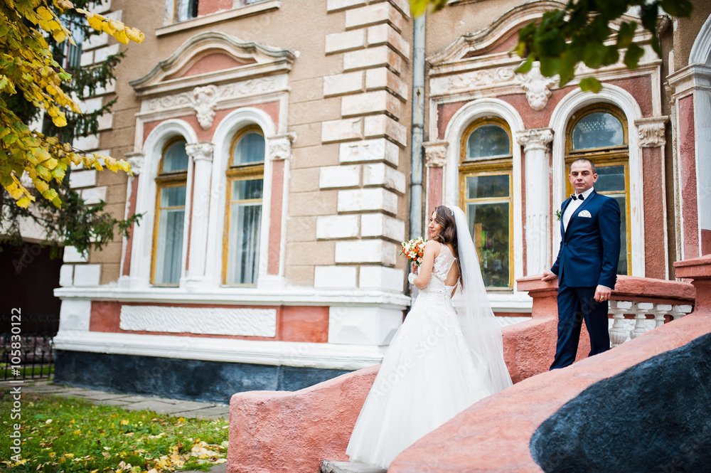 Wedding couple in love bacground old brick house Wedding couple in love bacground old brick house