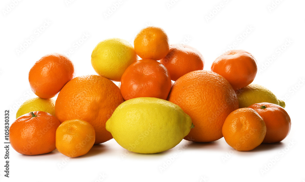 A heap of mixed citrus fruit including lemons, tangerines, oranges isolated on a white background, close up A heap of mixed citrus fruit including lemons, tangerines, oranges isolated on a white background, close up