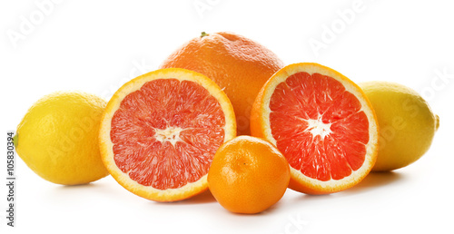 Mixed citrus fruit including sliced grapefruit isolated on a white background  close up