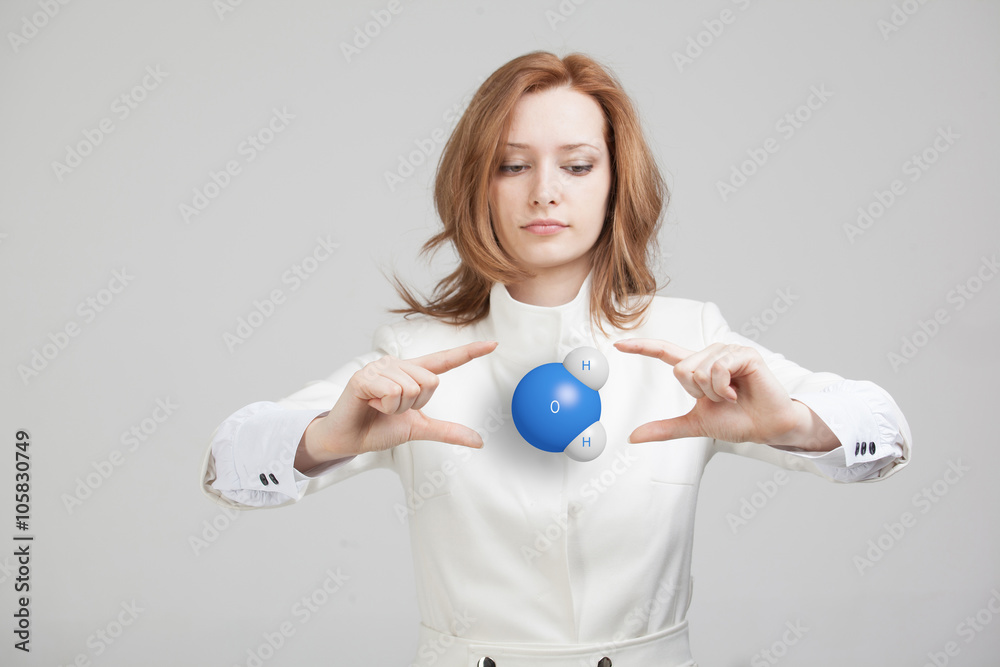 Young woman scientist with model of water molecule. Young woman scientist with model of water molecule.