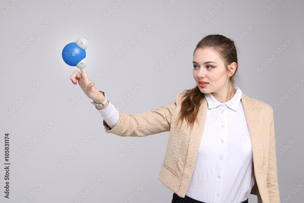 Young woman scientist with model of water molecule. Young woman scientist with model of water molecule.