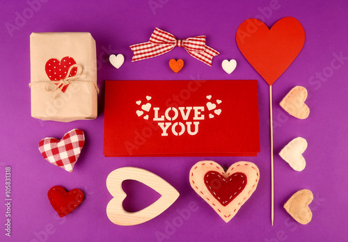 Gift set for Valentines Day with box and card on purple background