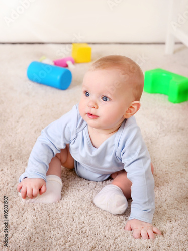 Cute baby with plastic toys...