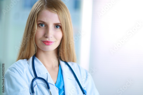 Doctor  woman is standing in the near window  photo