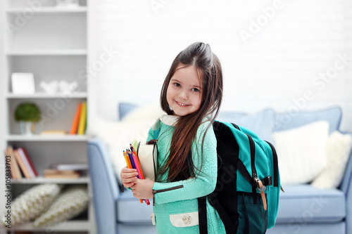 Little girl with green back...