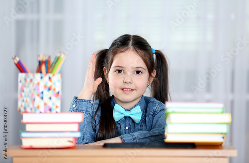 Little girl with books and ...