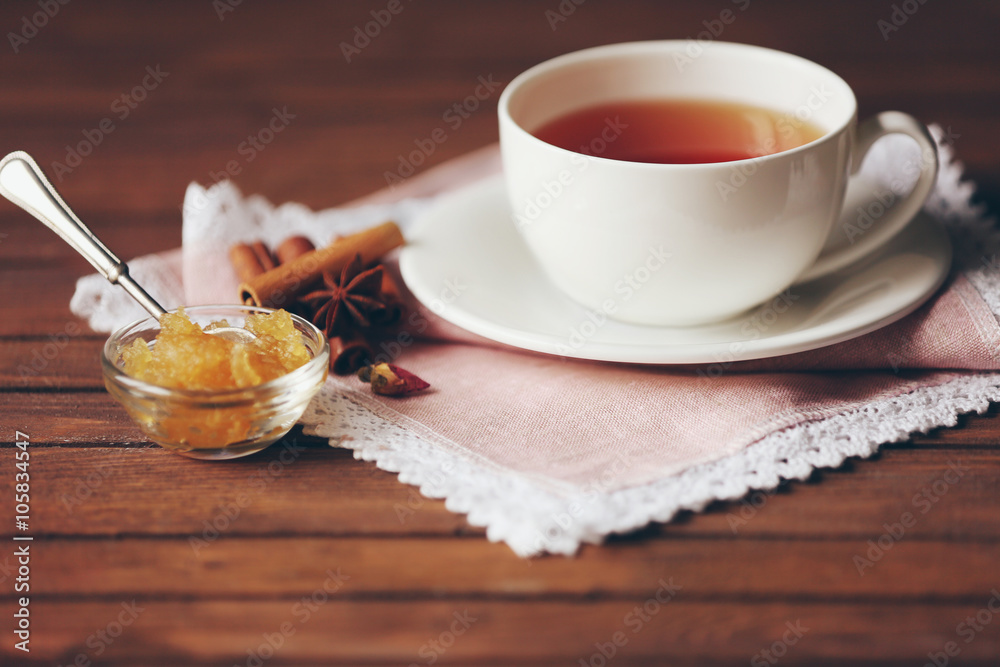 Cup of tea, honey and spices on table closeup Cup of tea, honey and spices on table closeup