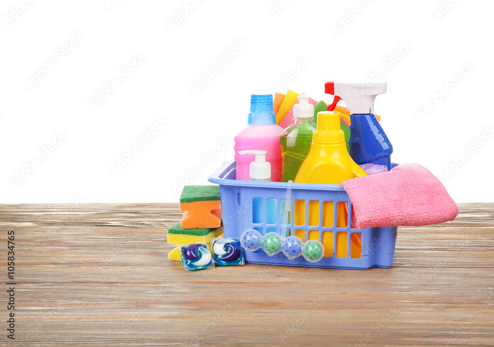 Basket of cleaning supplies on the floor Basket of cleaning supplies on the floor