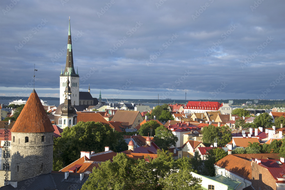 Old city under a low cloudy sky. Tallinn, Estonia