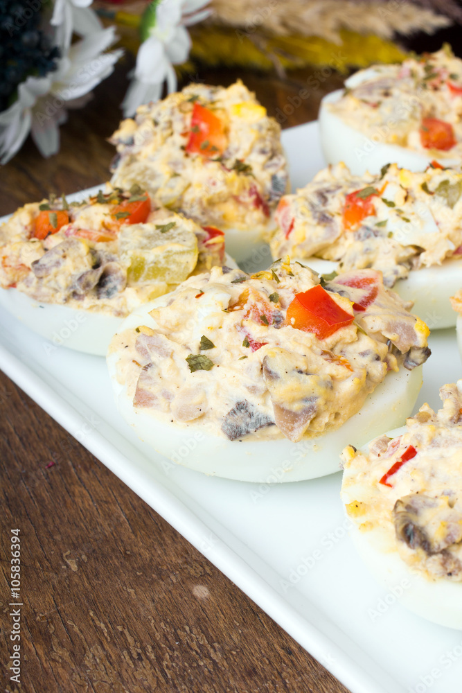 stuffed eggs with peppers, mushrooms and herbs - selective focus stuffed eggs with peppers, mushrooms and herbs - selective focus