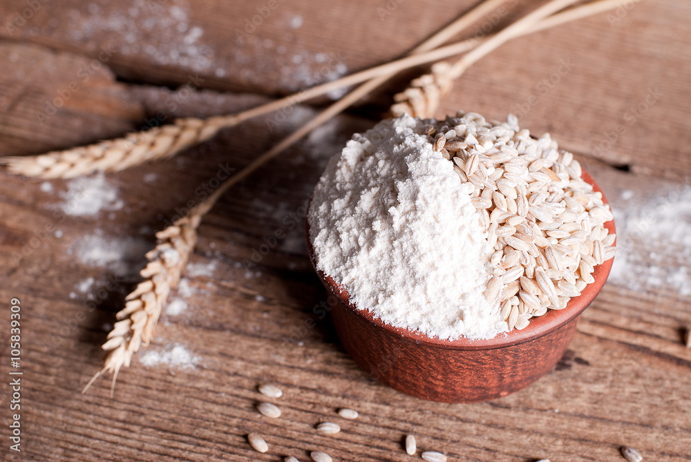 Wheat flour in a bowl on a table Wheat flour in a bowl on a table