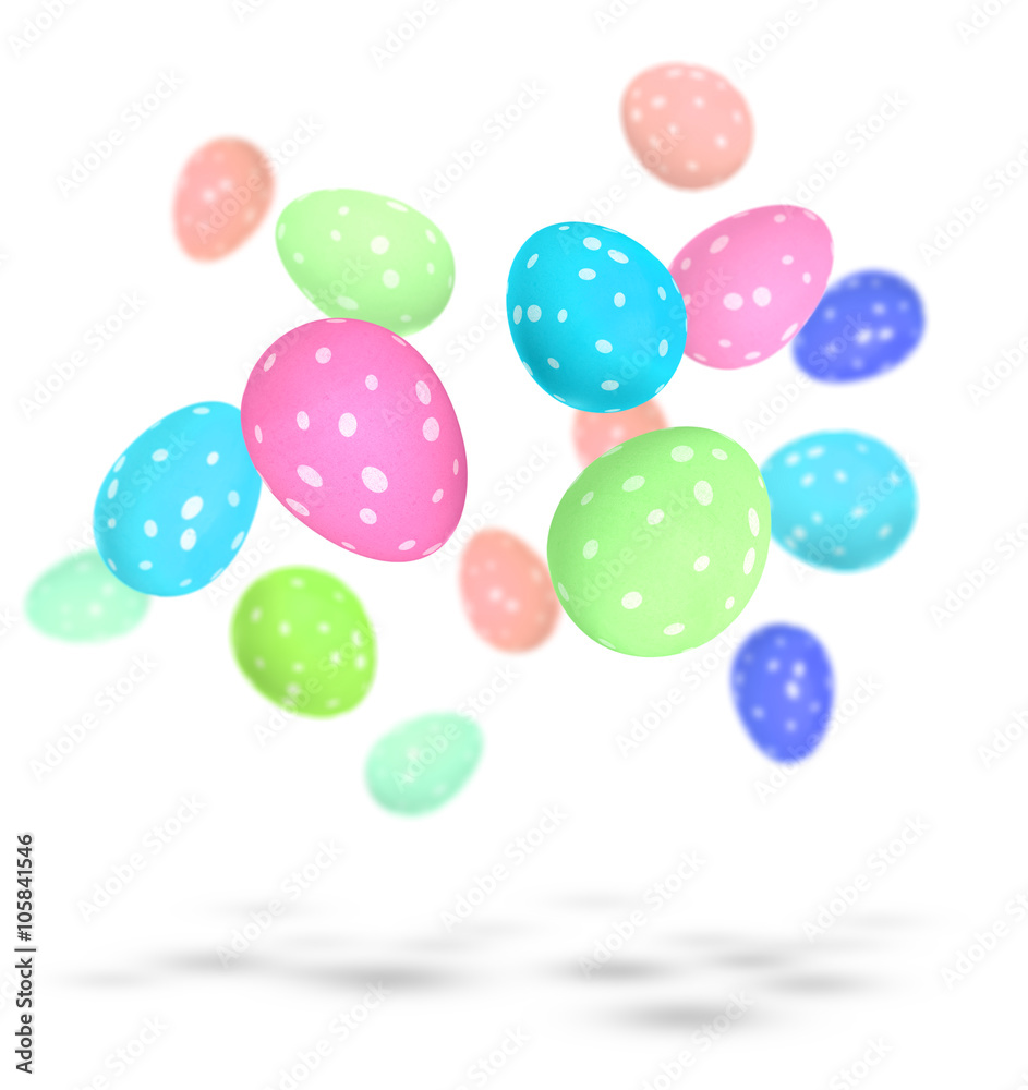 Brightly painted Easter eggs with spots falling to the ground Brightly painted Easter eggs with spots falling to the ground