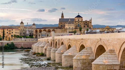 Cordoba, Spain town skyline at the Roman Bridge and Mosque-Cathedral. photo