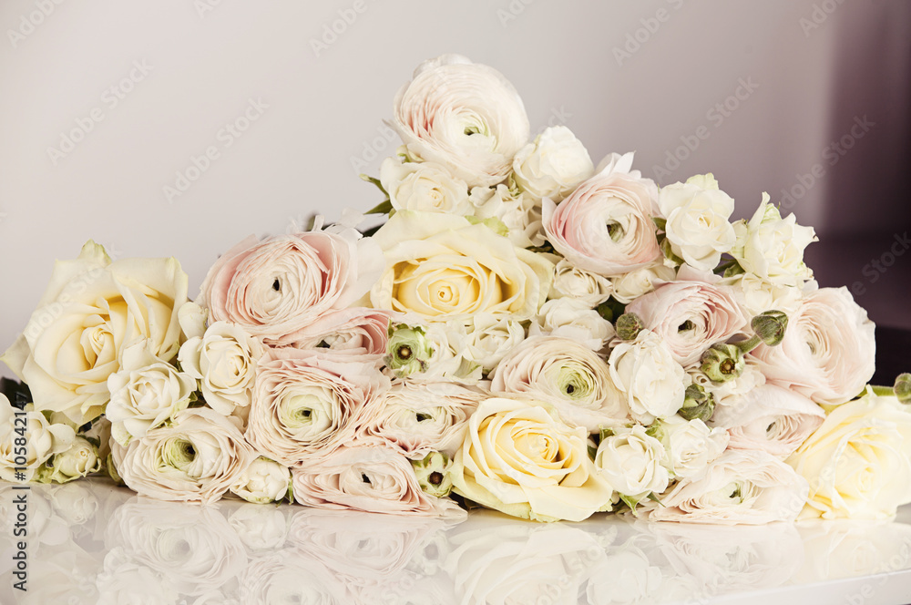 Beautiful wedding bouquet with rose bush, Ranunculus asiaticus a