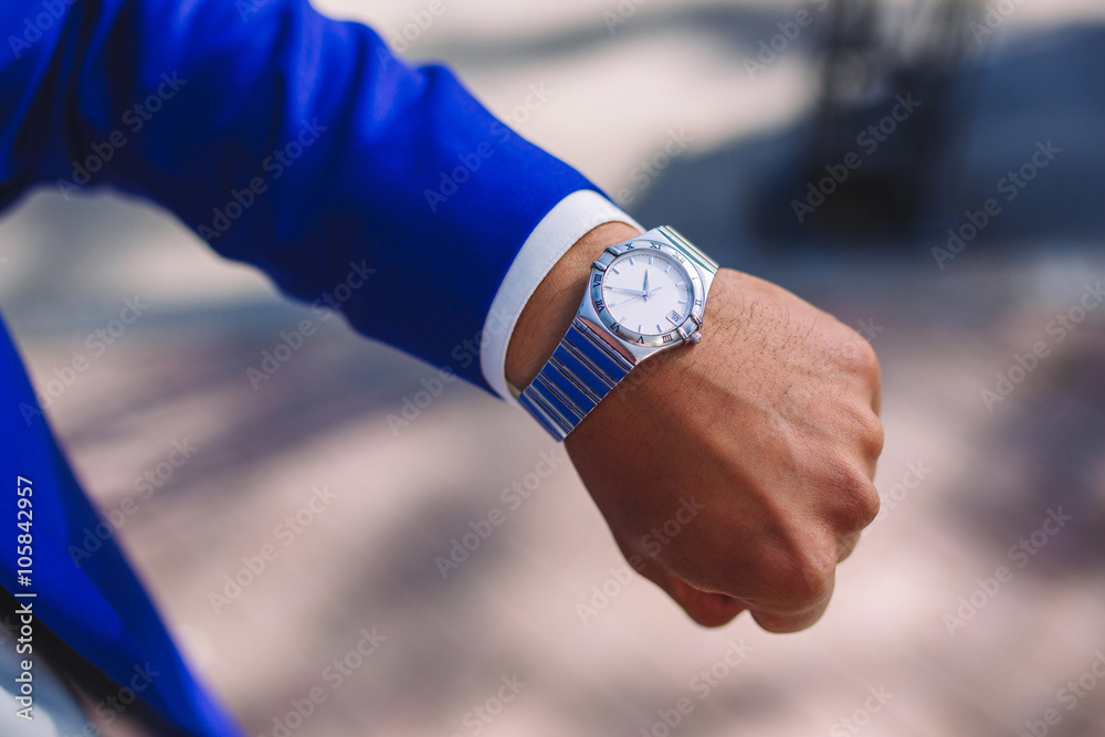 Man's hand with clock closeup Man's hand with clock closeup