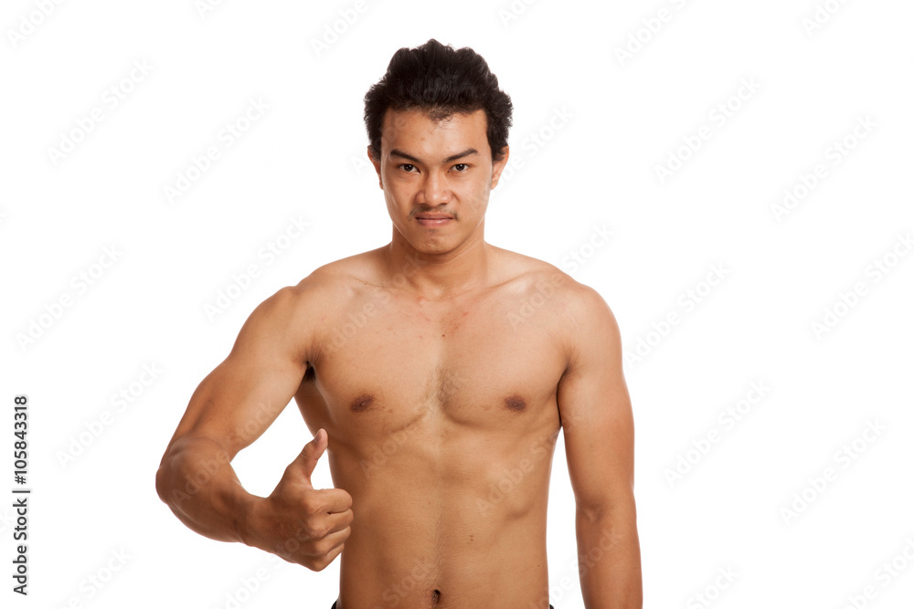 Muscular Asian man show thumbs up