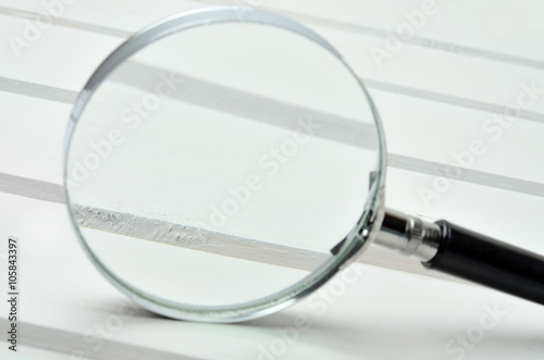 Obraz na płótnie Magnifying glass on table