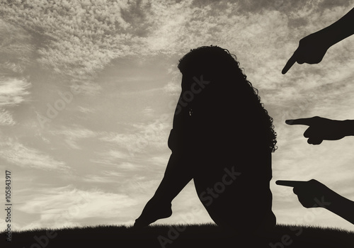 Silhouette of a woman and condemning the hands photo