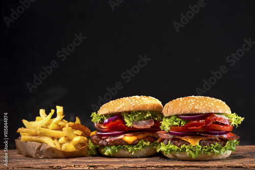 Delicious hamburger on wooden table