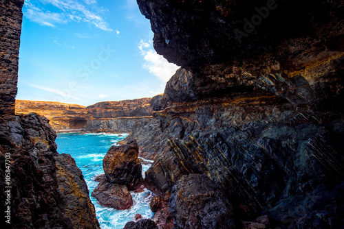 Black volcanic caves near Ajuy village on Fuerteventura island in Spain photo