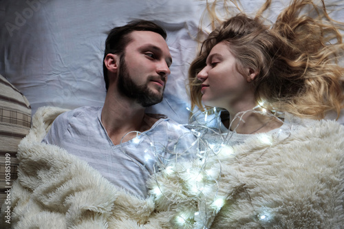 Loving couple in the cozy light house