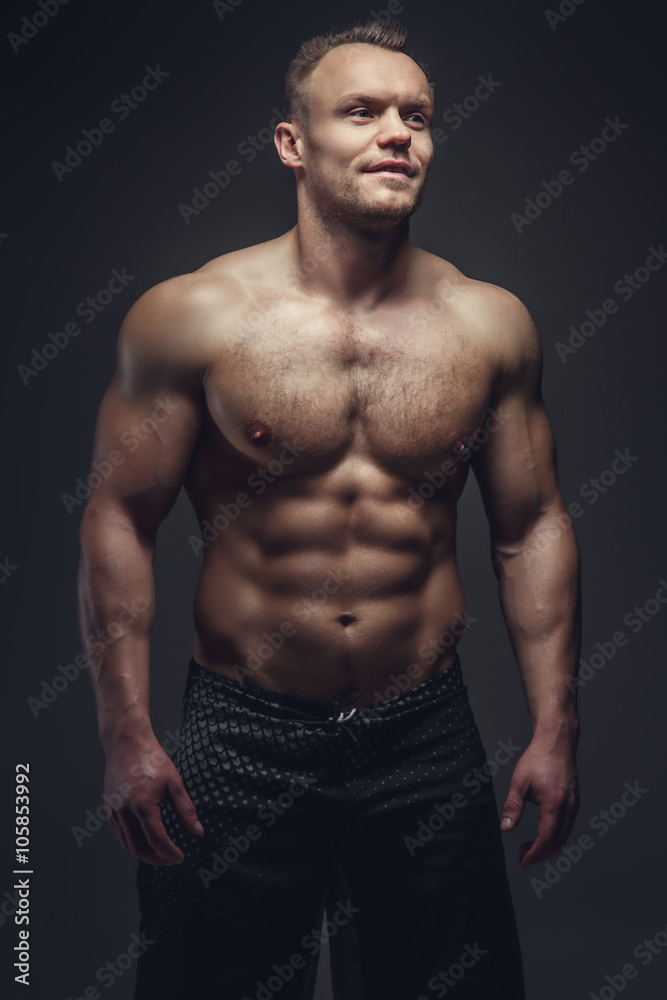 A man showing his athletic torso. A man showing his athletic torso.