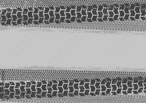 Tire tracks background in grunge style, gray colors