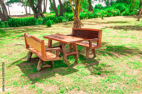 Wooden furniture table and chairs in the nature environment in s