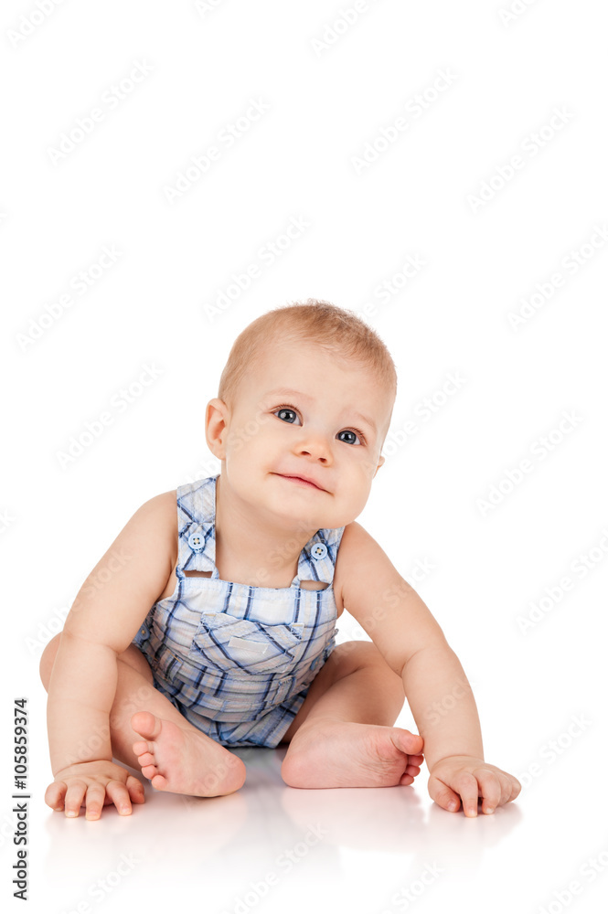 Baby is sitting on floor, isolated on white Baby is sitting on floor, isolated on white