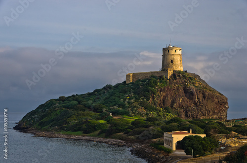 Tower Coltellazzo of Saint Efisio lighthouse at Nora archeological site, gulf of Cagliari, Sardinia, Italy © banepetkovic