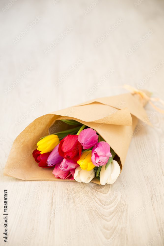 bouquet of fresh spring colourful tulips on wooden board bouquet of fresh spring colourful tulips on wooden board