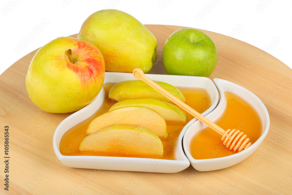 apples and dipping slices of apple in honey apples and dipping slices of apple in honey
