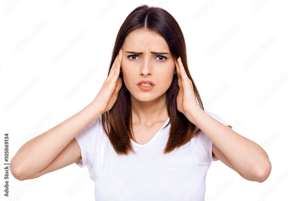 A young girl feels headaches and dizziness. White background. A young girl feels headaches and dizziness. White background.