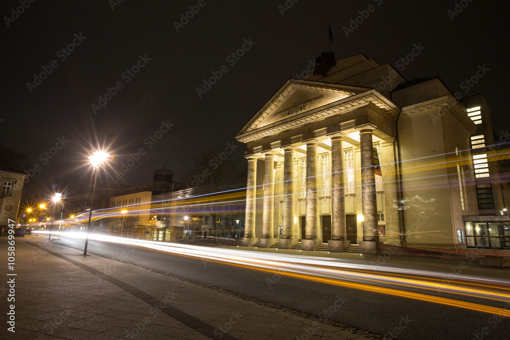 theater detmold germany in the evening with traffic lights