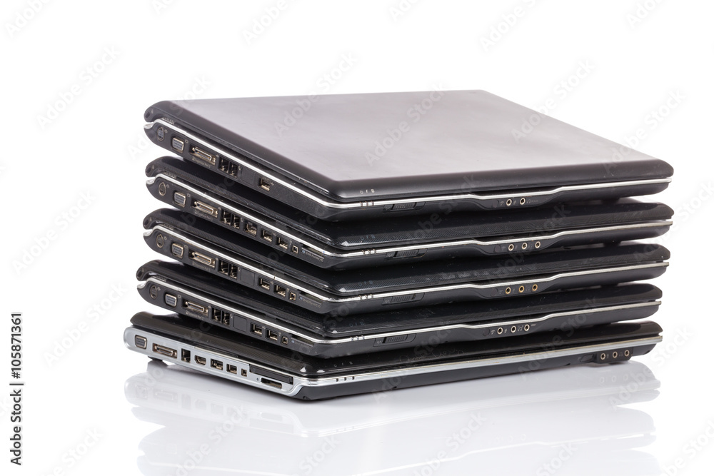 stack of old laptops awaiting repair stack of old laptops awaiting repair