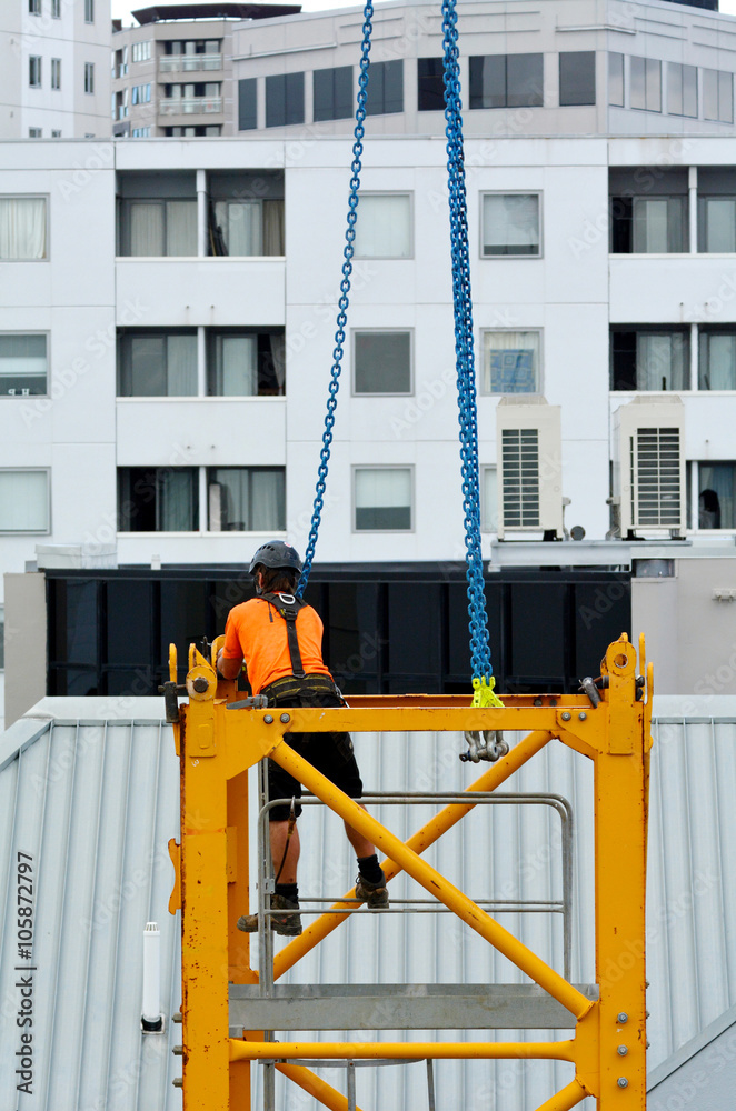 Builder assemble a construction tower crane