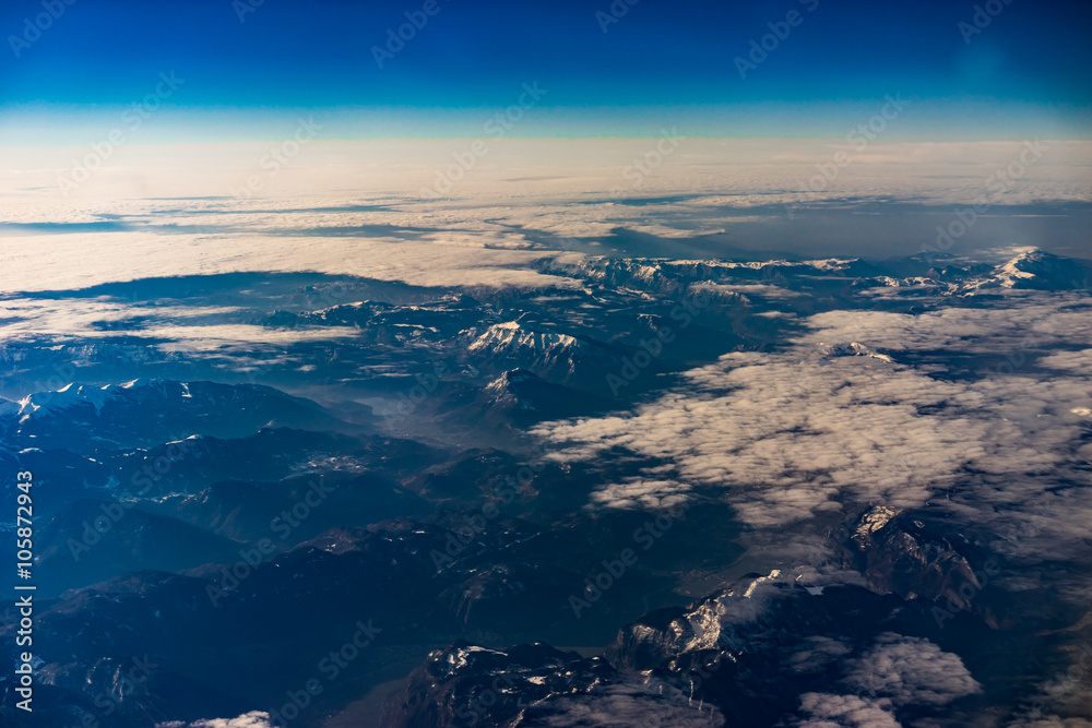 Mountains in winter during sunrise from the air - Alps Mountains in winter during sunrise from the air - Alps