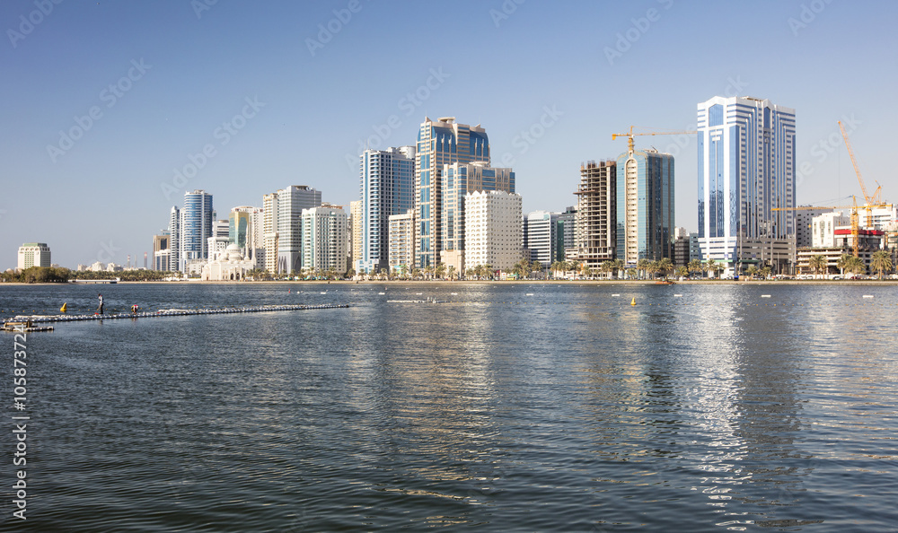 reflections of skyscrapers in water in city in united emirates