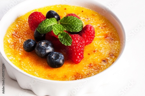 Creme brulee Dessert wih fruits and mint leaves